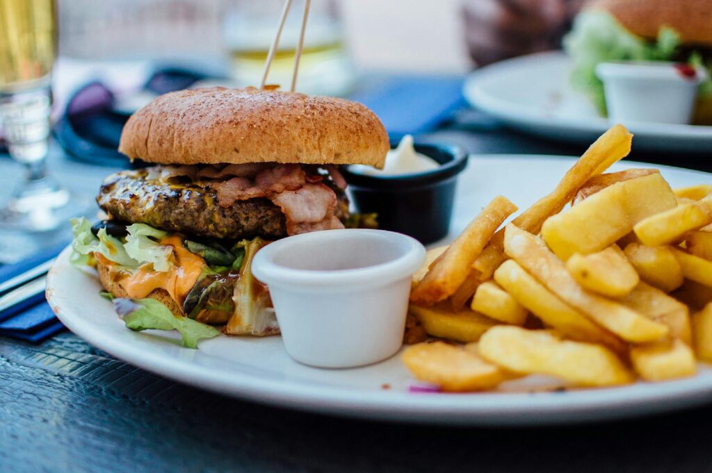 A cheeseburger and fries on a plate