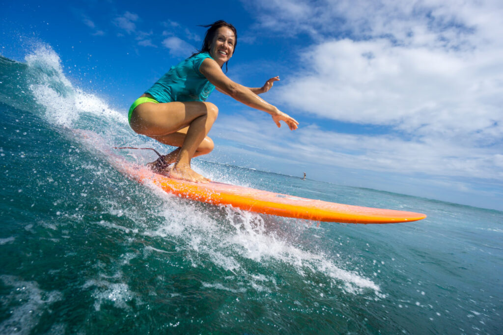 a woman surfing on the ocean